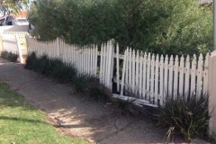 Damaged traditional Pickett fencing